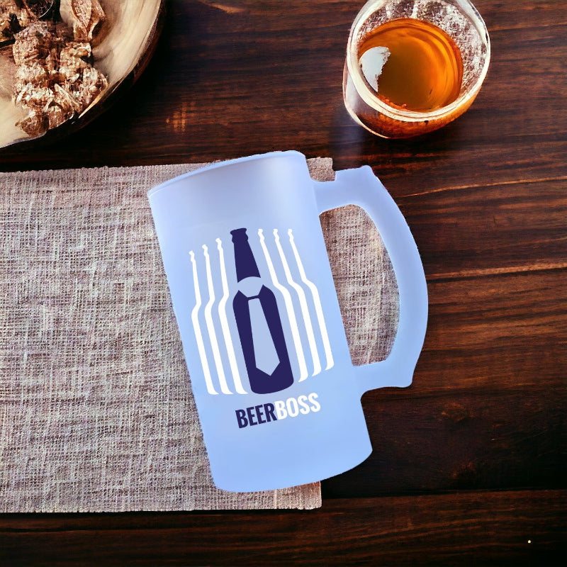 Blue 'Beer Boss' mug on a wooden table with a glass of amber liquid and a plate of food.