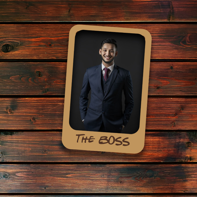 Man in a suit with 'The Boss' text on a wooden background