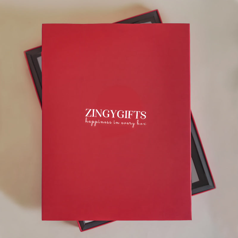 Red gift box with 'ZINGYGIFTS' branding on a beige background