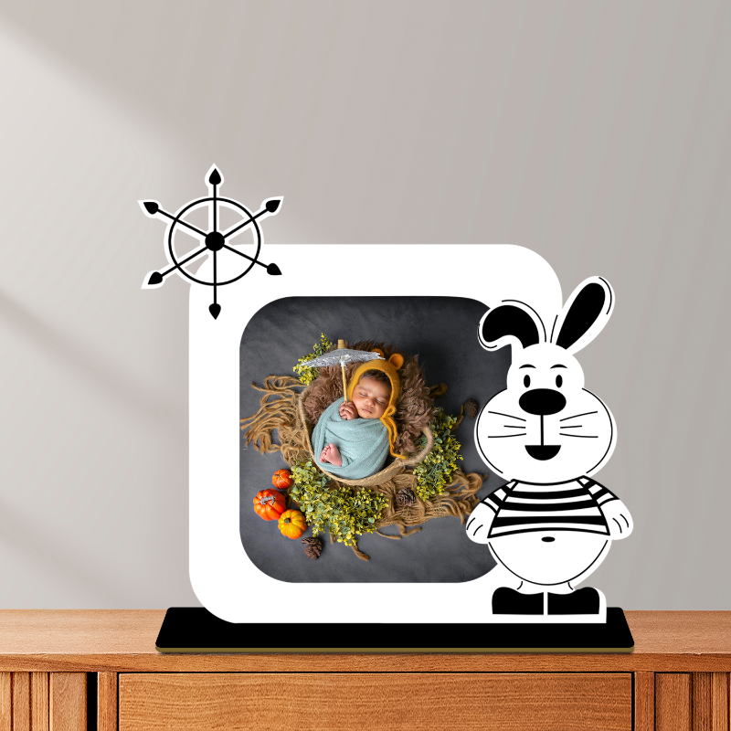 Decorative lamp with a cartoon rabbit design on a wooden surface.