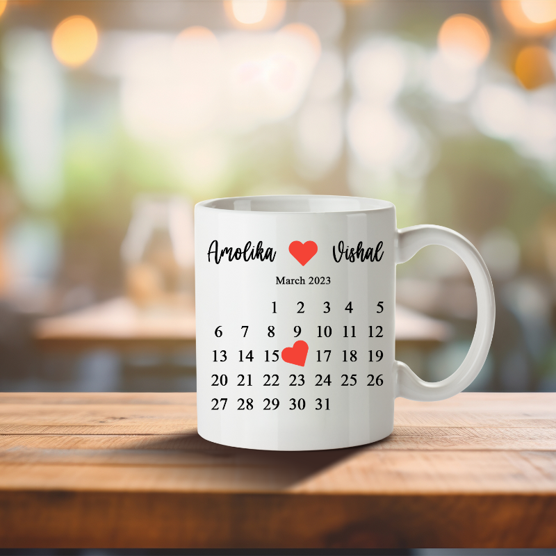 White mug with personalized names and dates on a wooden table