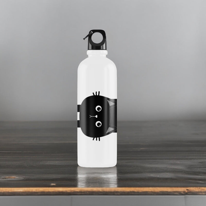 White water bottle with black cat design on a wooden surface