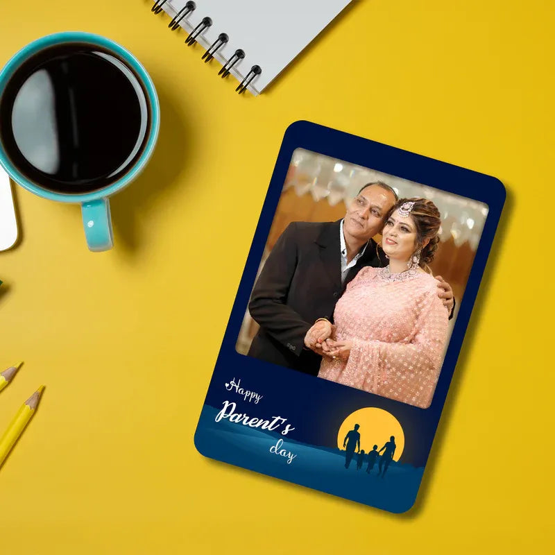 Fridge Magnet with a photo of a couple on a yellow background with a cup of coffee and notebook.
