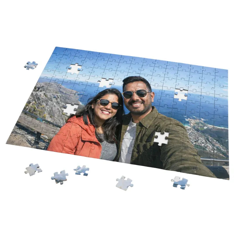 Jigsaw puzzle with a picture of a couple on a scenic background
