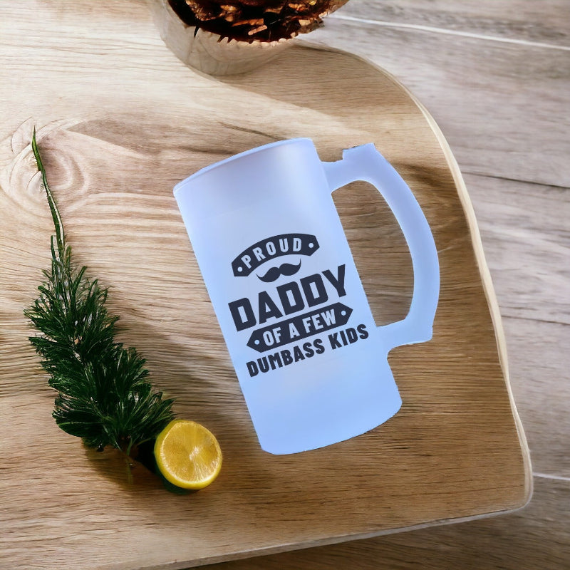 White mug with text on a wooden surface with a lemon and plant