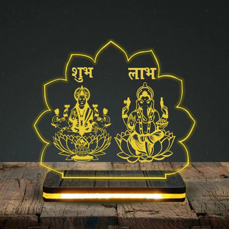 Decorative lamp with yellow engravings of deities on a dark background