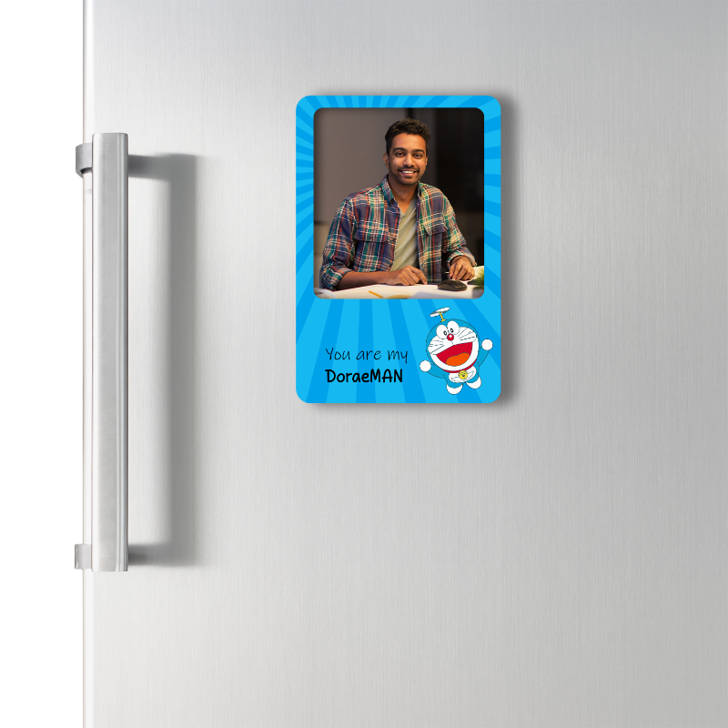 Fridge magnet with a cartoon character and text on a refrigerator