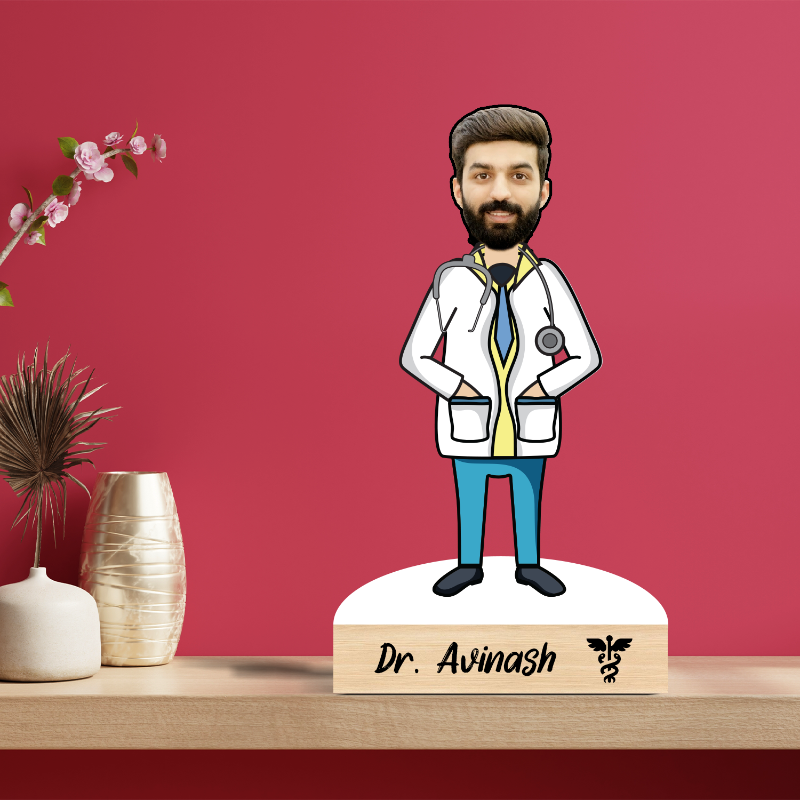 A personalized wooden caricature of a doctor with a beard, wearing a white coat, standing on a wooden base which includes a name and a small logo.