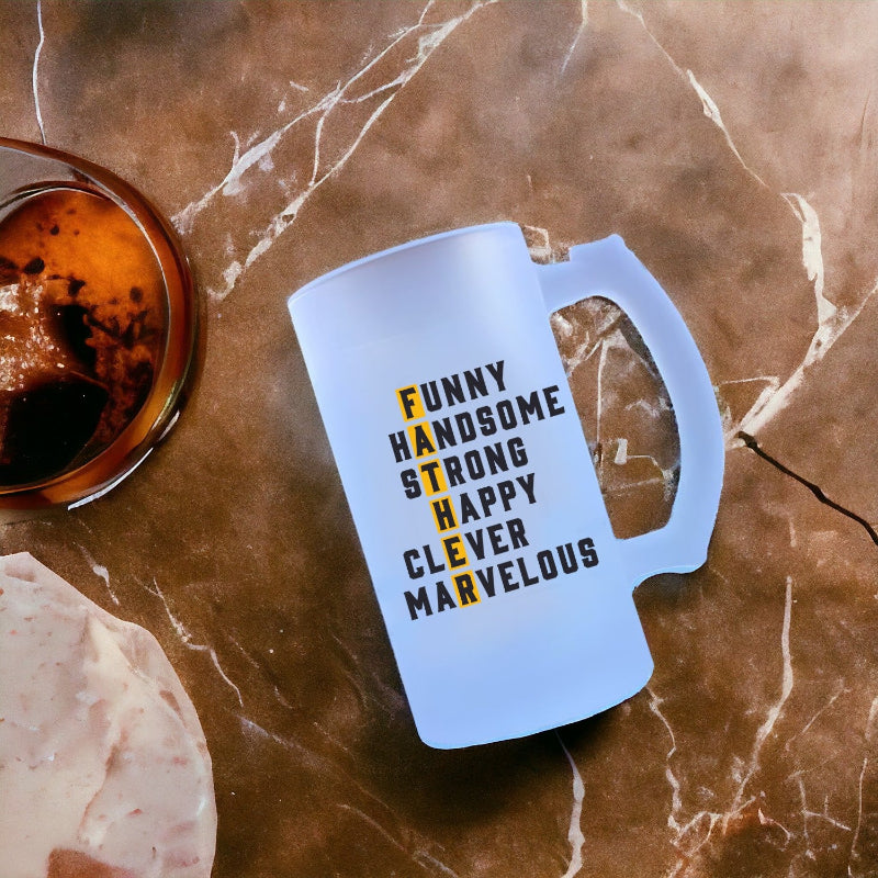 Blue mug with motivational text on a marble surface with a glass of coffee.