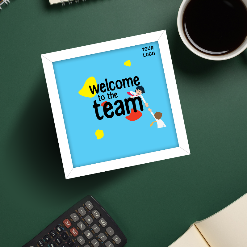 A 'Welcome to the Team' frame with a blue background, featuring an illustration of two hands extending upwards, and the text 'YOUR LOGO HERE' on the top. The frame is presented on a desk with a cup of coffee and a notebook in the background.