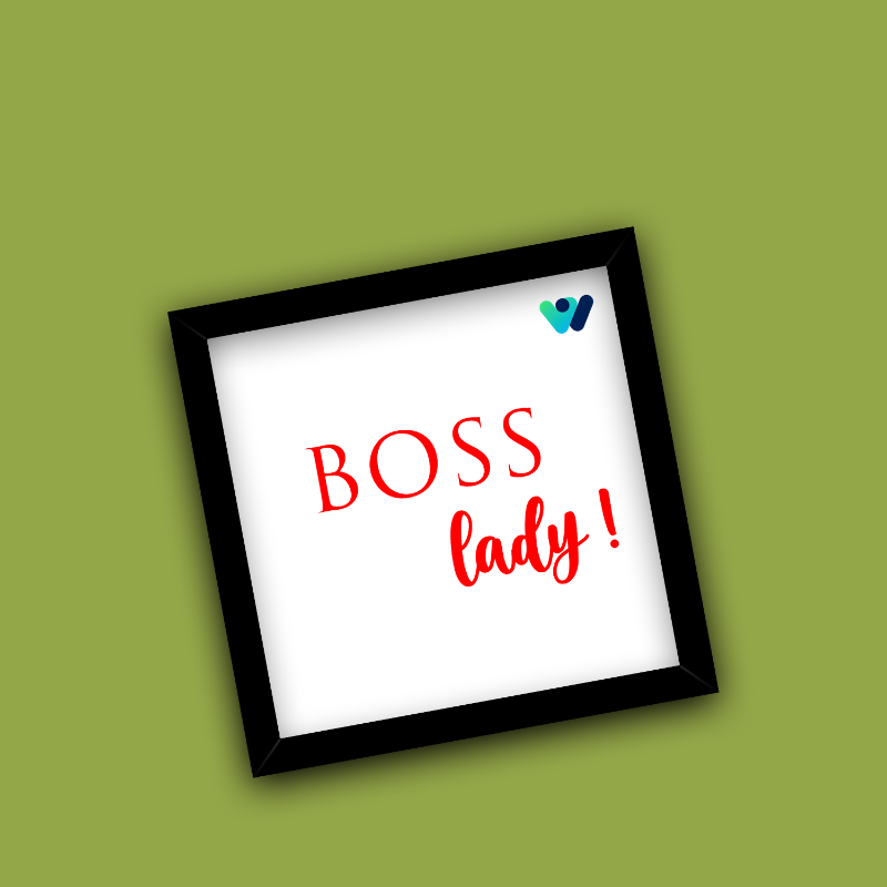 Framed sign with 'BOSS lady!' text on a green background