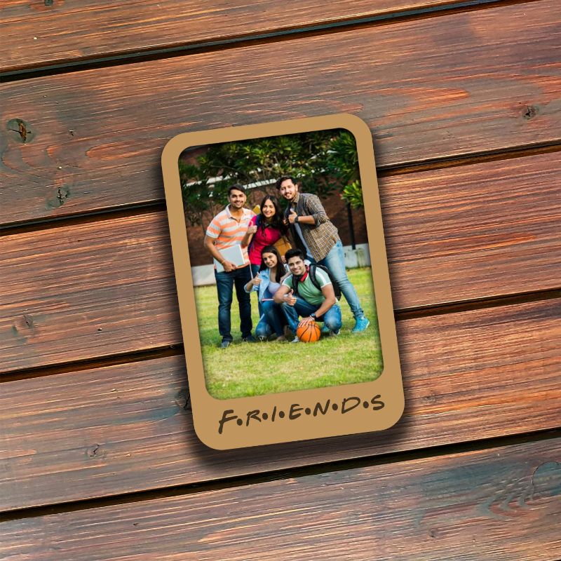 Memorabilia card with a photo of a group of people on a wooden surface