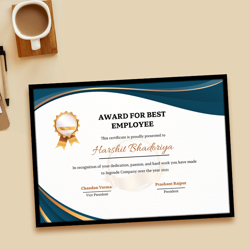 Award for best employee certificate on a desk with a cup of coffee