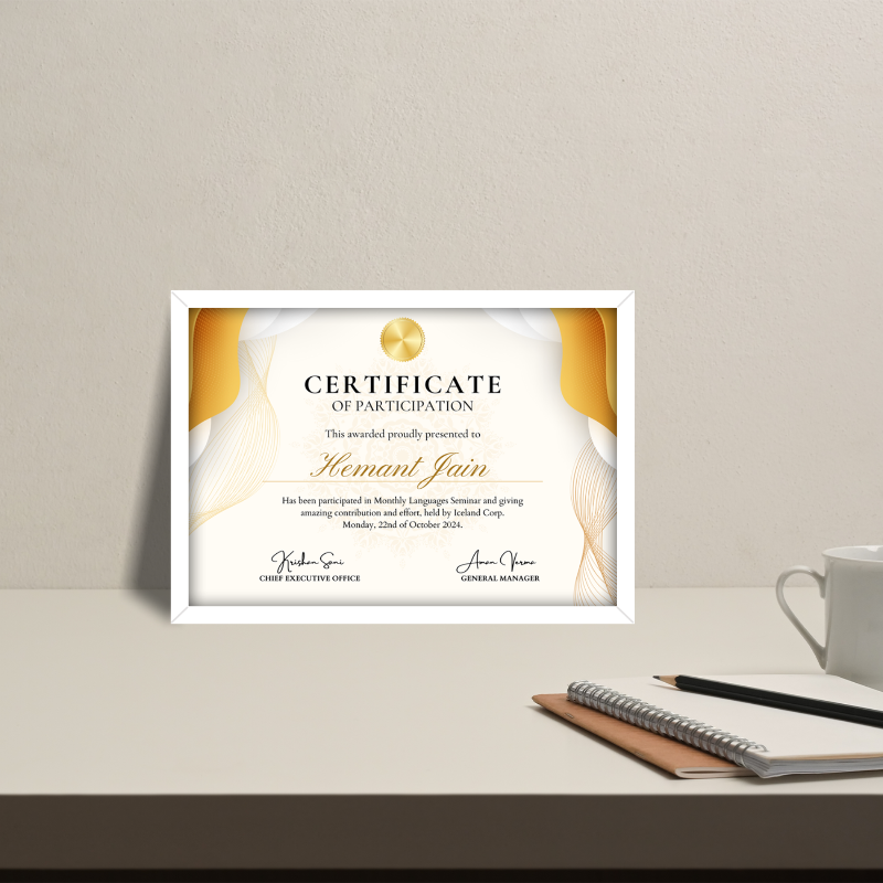 Certificate of participation on a desk with a cup and notebook