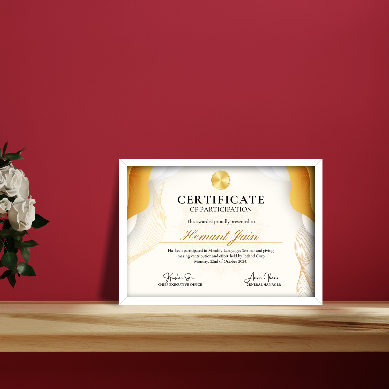 Certificate of participation framed on a wooden surface with a red wall background