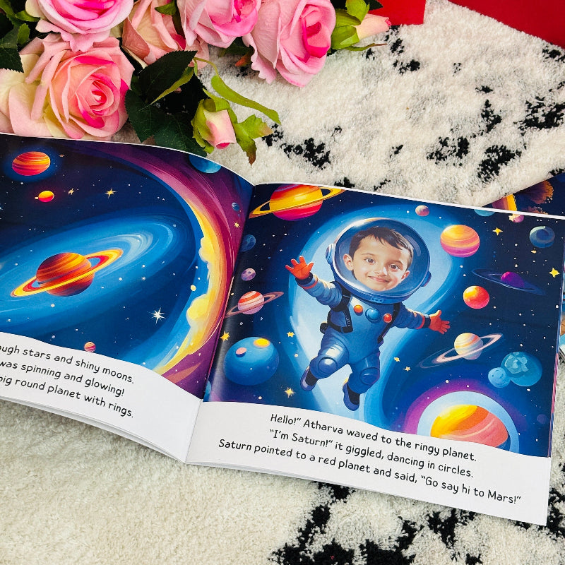 Children's book with space-themed illustrations and a child's face, surrounded by pink roses.
