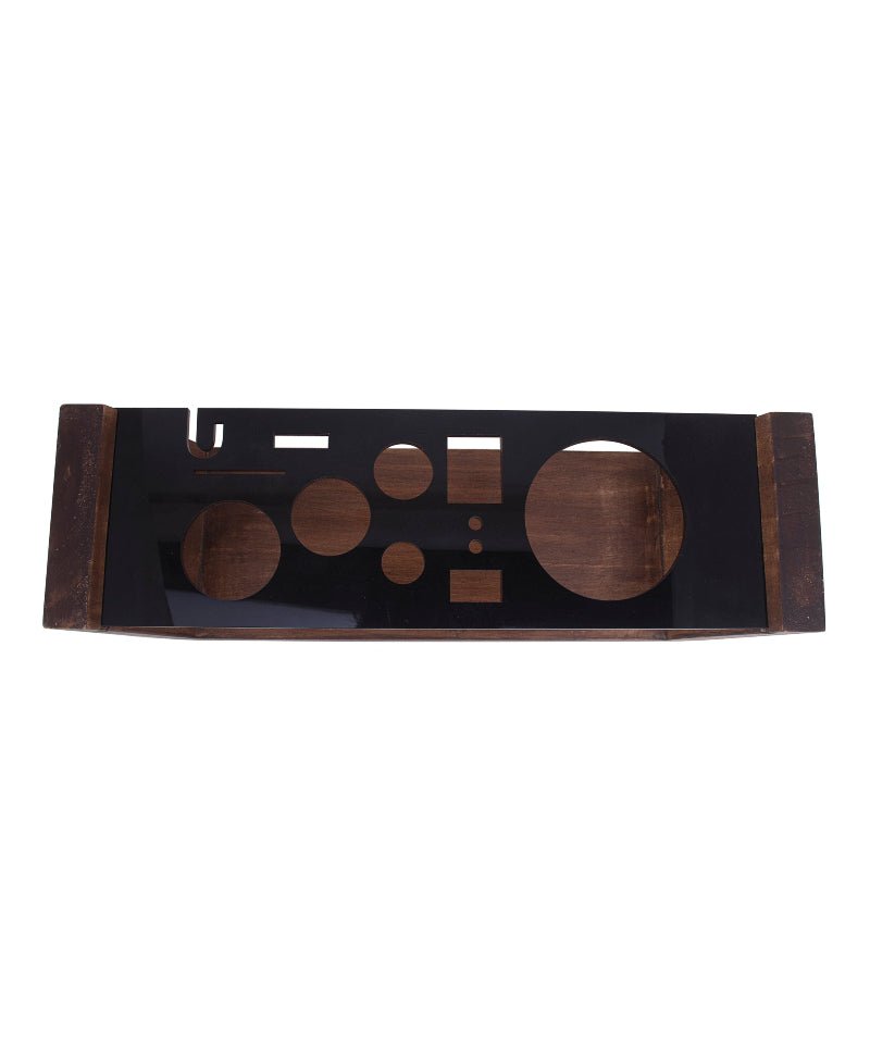 Decorative wall piece with geometric shapes on a black background