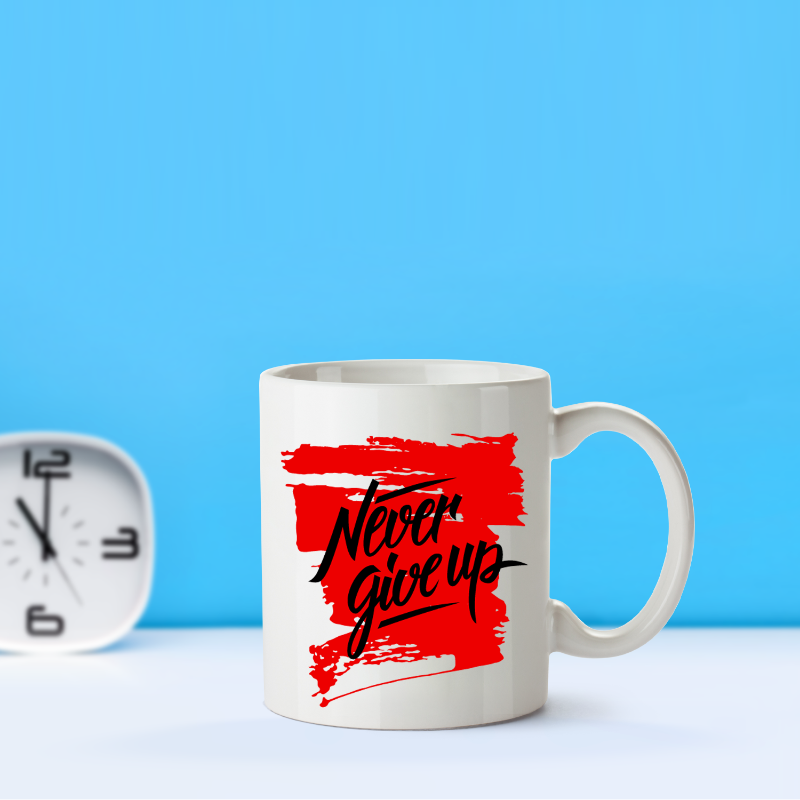 White mug with 'Never give up' text on a red background, next to a clock against a blue background