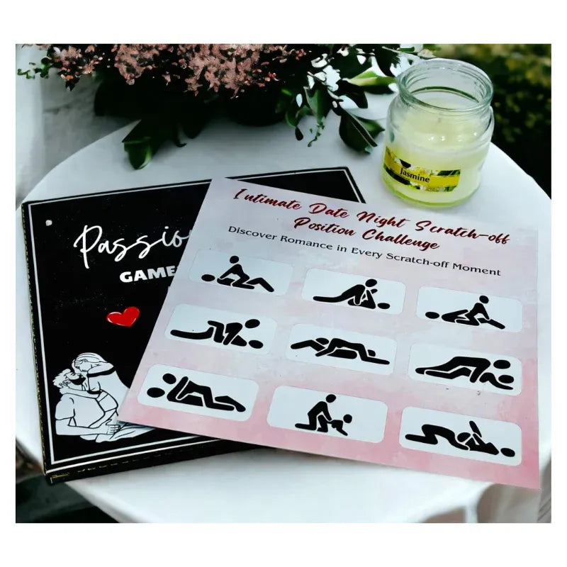 Passion game card with scratch-off design on a table with a candle and flowers.