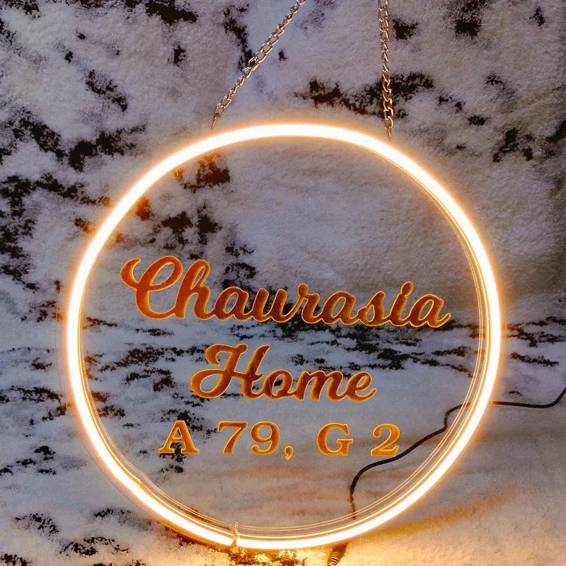 Neon sign with 'Home' text on a marble background