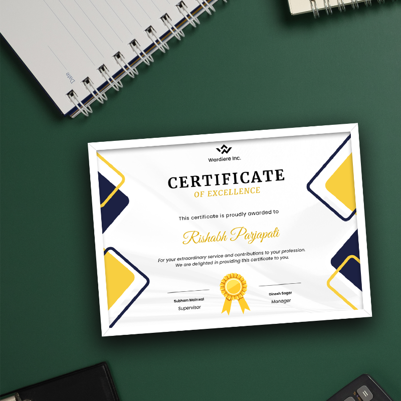 Certificate of Excellence on a green surface with a notebook and smartphone.