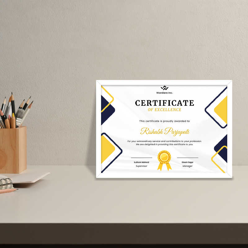 Certificate of Excellence on a gray surface with office supplies in the background