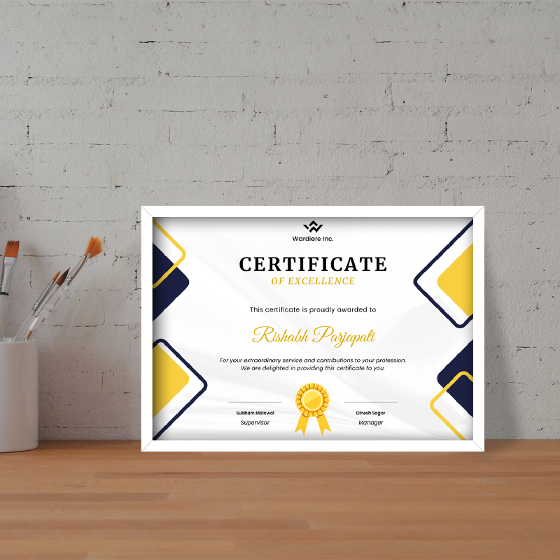 Framed certificate of excellence on a wooden surface with a gray brick wall background