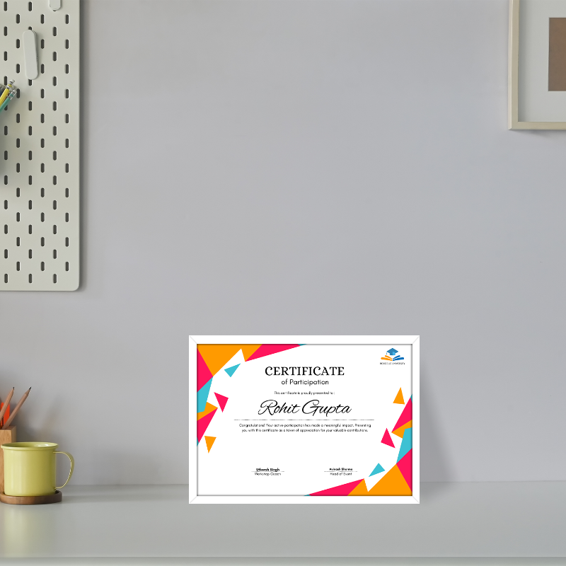 Colorful certificate of participation on a gray wall with a cup and wall decor.