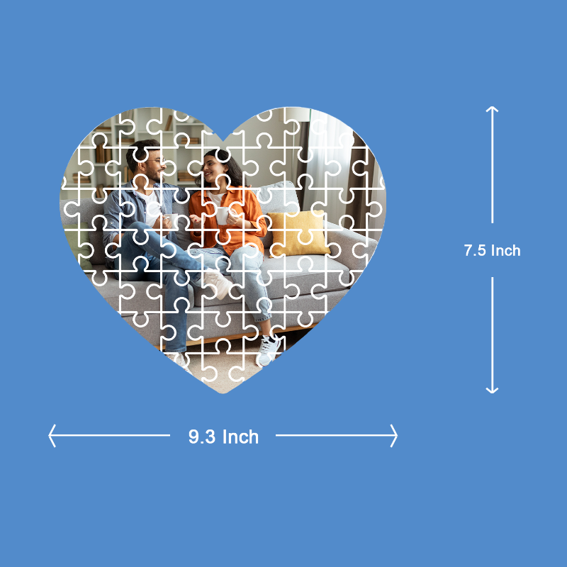 Heart-shaped puzzle with a couple on a couch, measurements indicated on a blue background