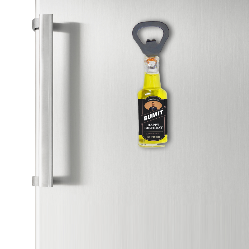 Bottle opener with a bottle design attached to a refrigerator door.