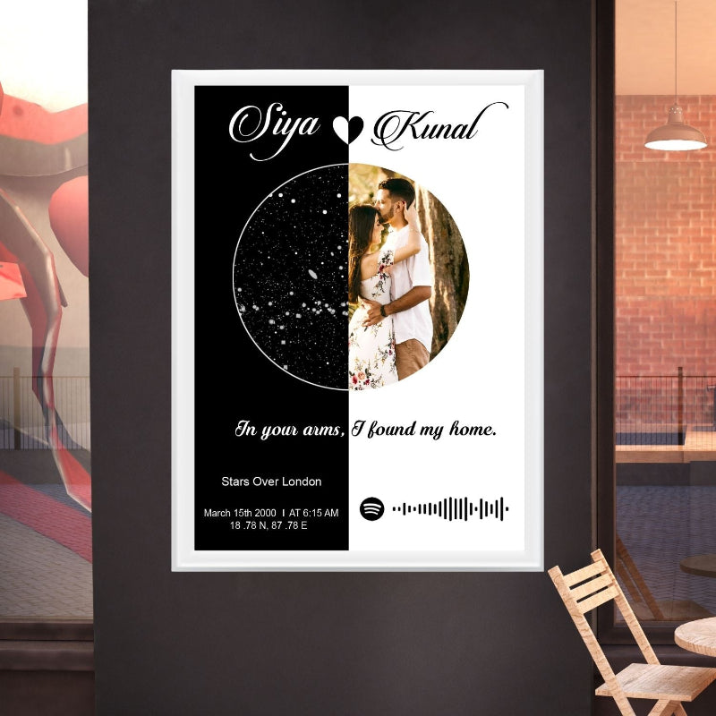 Personalized poster with couple's name, location, and date on a black wall.