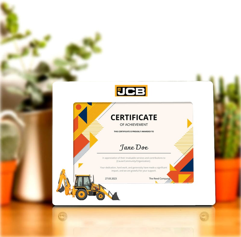 JCB certificate of achievement on a wooden surface with plants in the background