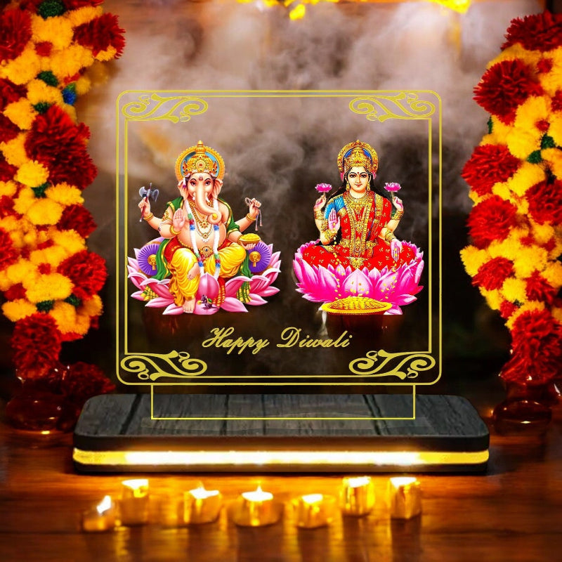 Decorative setup with Lord Ganesha and Goddess Lakshmi on a lotus, surrounded by flowers and candles, with 'Happy Diwali' text.