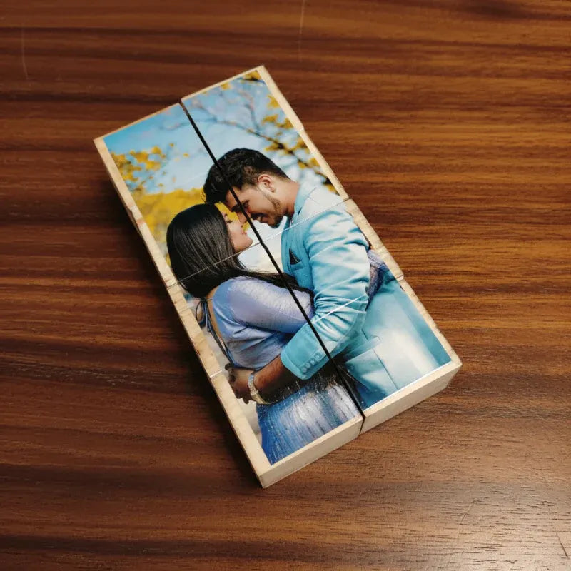 Wooden photo puzzle with a couple on a swing on a wooden surface