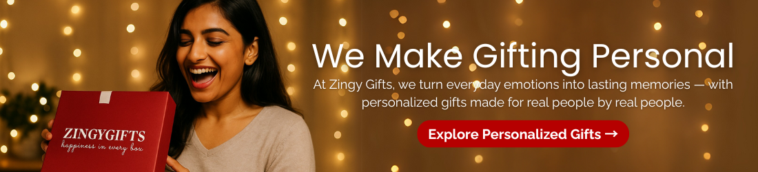 Woman holding a red gift box with decorative lights in the background