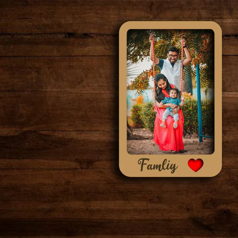 Family photo with 'Family' text and heart symbol on a wooden background