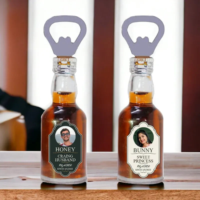 Two small bottles with labels and bottle openers on a wooden surface.