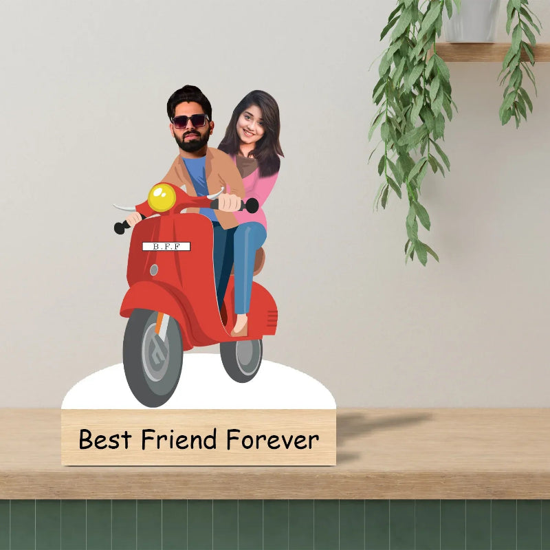 Decorative piece with a couple on a red scooter and 'Best Friend Forever' text on a wooden surface.