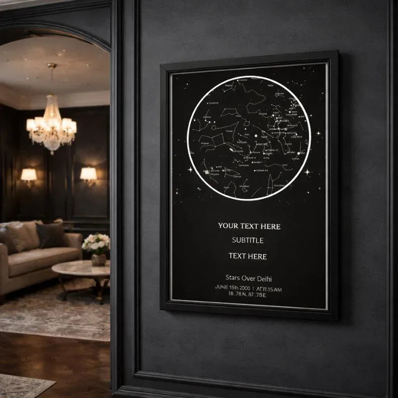 Framed star map poster on a dark wall with a living room in the background