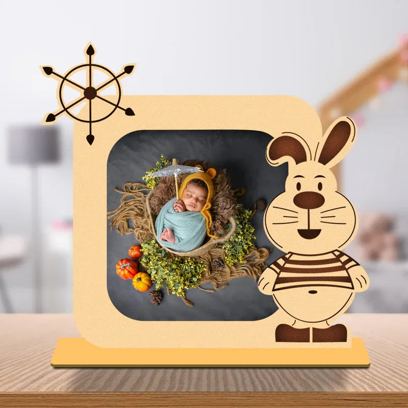 Wooden photo frame with a cartoon rabbit design on a blurred background