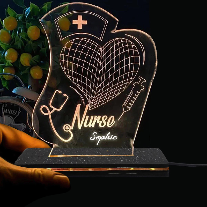 A custom LED name lamp for nurses and doctors, featuring a heart-shaped design with a stethoscope and medical cross, with the name 'Sophie' inscribed.