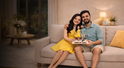 Husband and wife posing with a custom 2D caricature statue featuring their names, personalized romantic gift for couples 