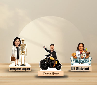  personalized caricature figures on a wooden surface with labels for 'Orthopedic Surgeon', 'I am a Rider', and 'Veterinarian Dr Shivani'.