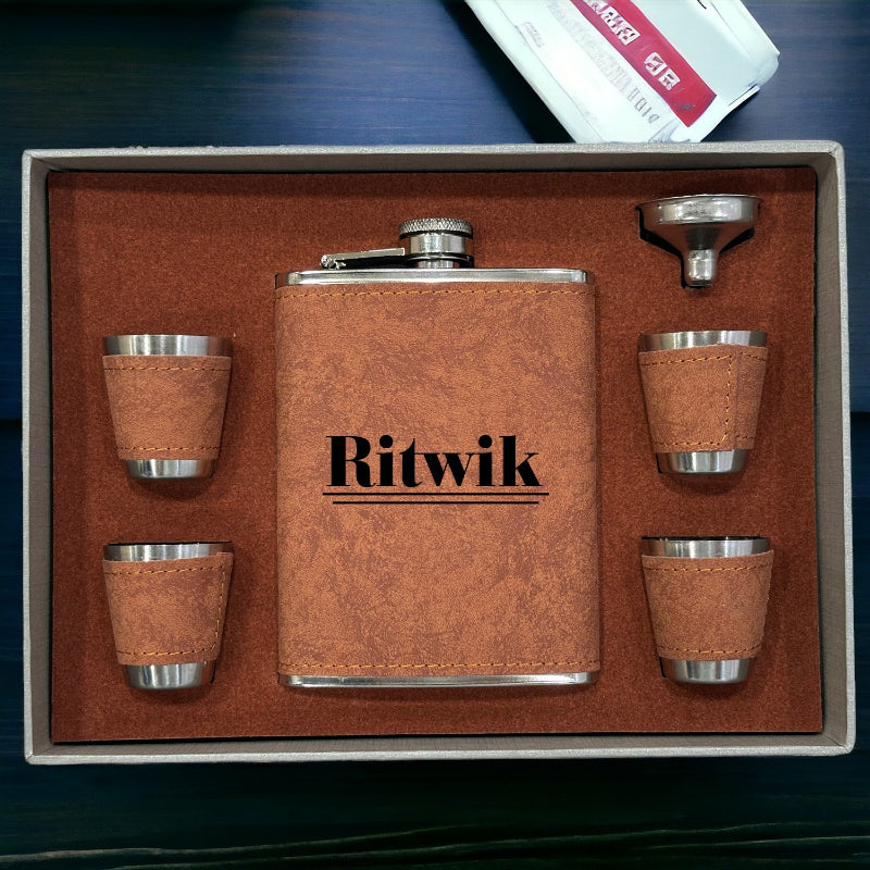 A personalized croc-tan leather hip flask set with four matching glasses, presented in a box with the name 'Ritwik' inscribed on the flask.