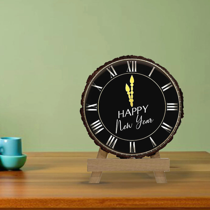 Round clock with 'Happy New Year' text on a wooden stand against a green background