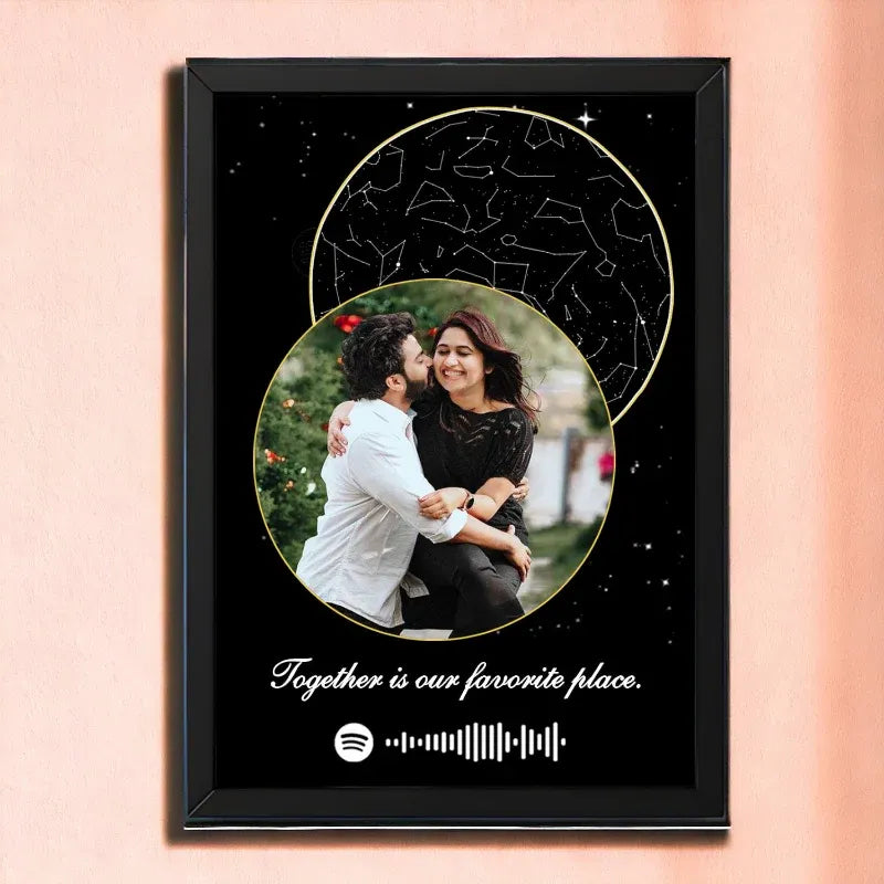Framed artwork with a couple embracing, a star map, and 'Together is our favorite place' text on a pink background.