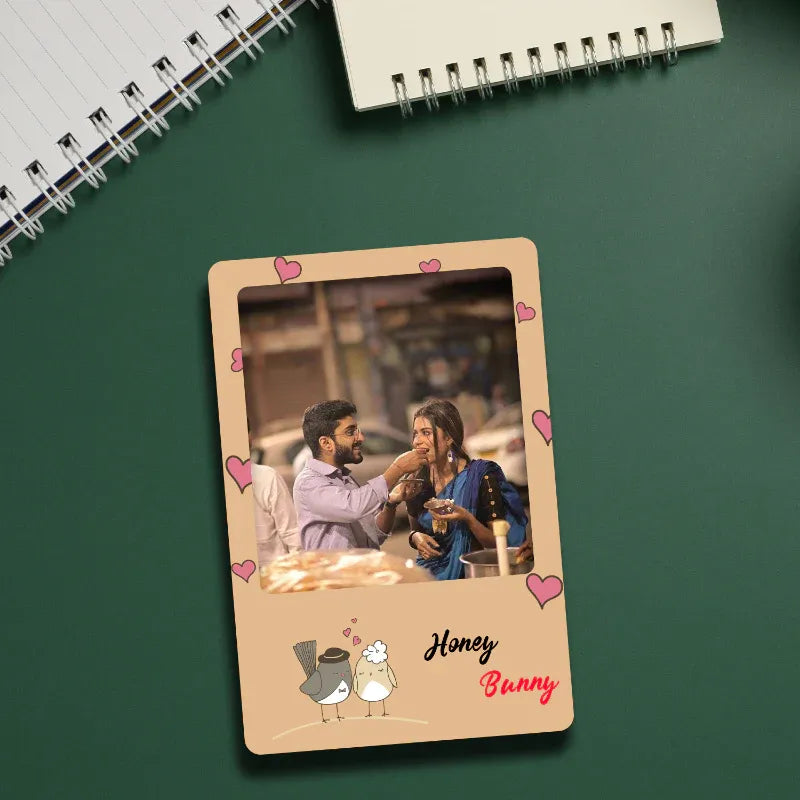 Personalized photo frame with a couple's photo and 'Honey Bunny' text on a green surface.