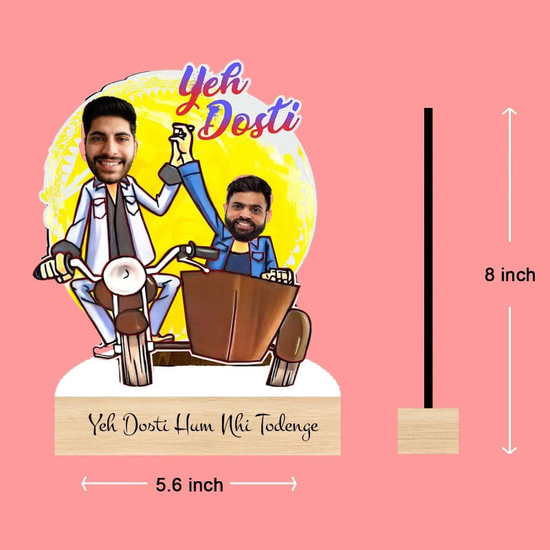 Cartoon depiction of two people on a motorcycle with 'Yeh Dosti' text, dimensions indicated, on a pink background.