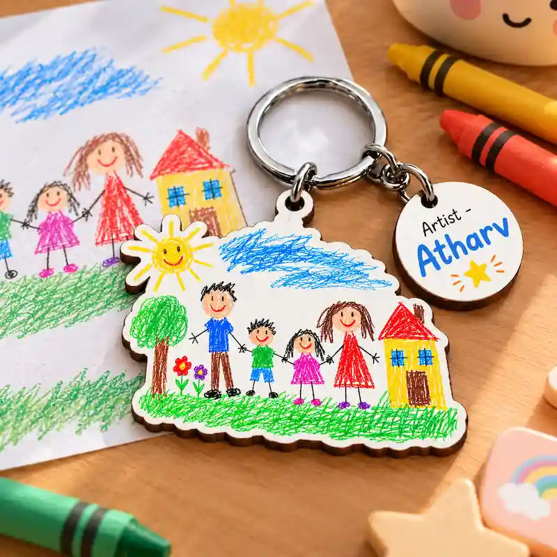 Custom child's drawing keychain of a family portrait with sun, tree and yellow house, round "Artist – Atharv" name tag