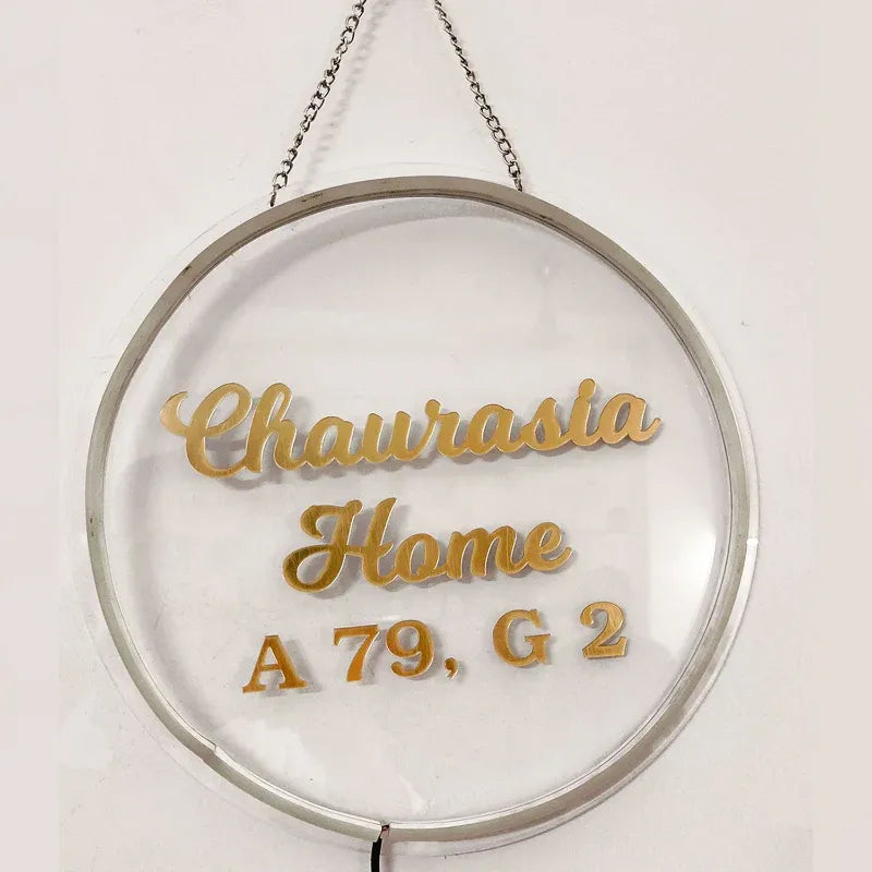 personalised round LED name plates for home with custom family name and address.